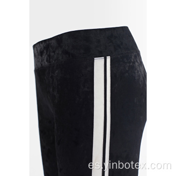 Leggings de terciopelo macizo para mujer.